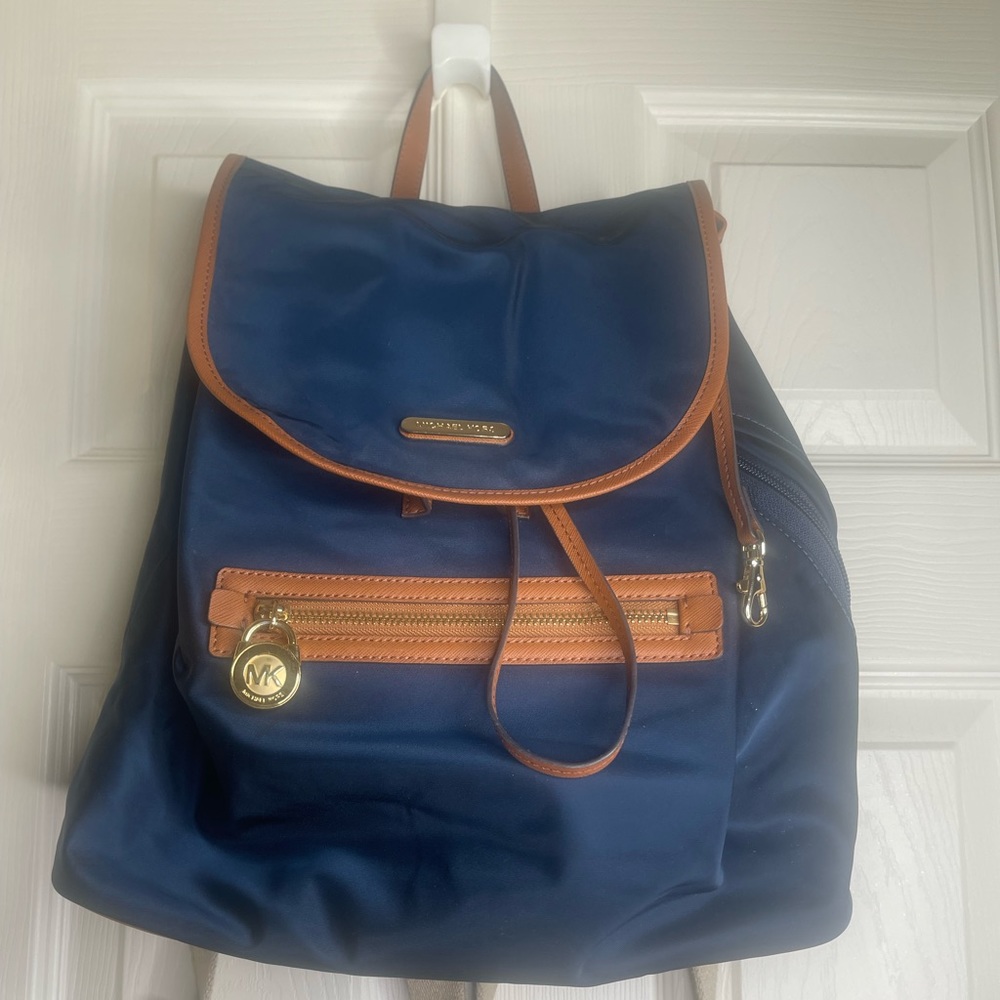 Michael Kors nylon authentic backpack measures 13x13”
